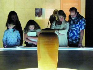 Visitors of U.S museum with original clay jar