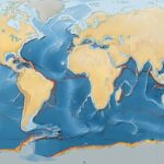 Earth Science in the News: Erratics, Earthquakes, and Ice This detailed world map illustrates tectonic plates with oceanic topography, highlighting plate boundaries and geographical features. The illustration provides a comprehensive view of the Earth's structure and geological activity.
