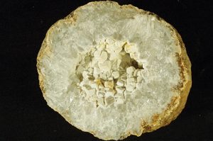 Keokuk geode half with broken pseudocubic quartz crystal