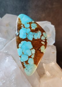 long shaped turquoise cabochon with three rounded edeges