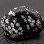 tumbled snowflake obsidian with snowflakes that are silicon dioxide polymorph cristobalite