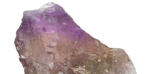 Ametrine: The Bicolor Quartz of Amethyst and Citrine ametrine crystal from Anahi Mine, Bolivia isolated on white background