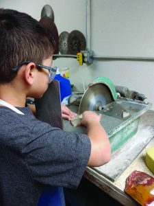 Theo at a lapidary machine