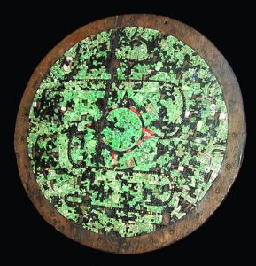 mixtec shield covered with turquoise tiles