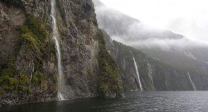 Waterfalls down steep cliff faces