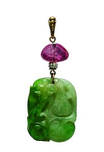 Carved jadeite pendant with gold, seed pearls, and amethyst