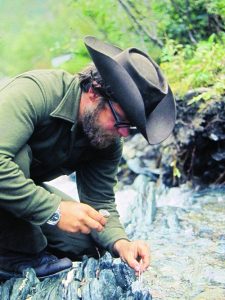 Steve Voynick picking gold nuggets