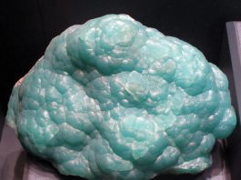smithsonite specimen mounted in a display case