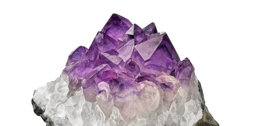 amethyst crystal cluster on white background used as stones to relieve stress