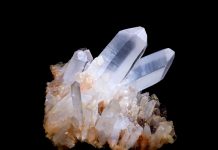 quartz specimen on black background quartz is a seven on the mohs scale of hardness