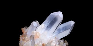 quartz specimen on black background quartz is a seven on the mohs scale of hardness