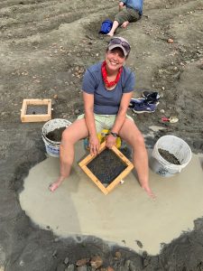 rockhounding woman screening for minerals