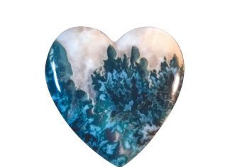Heart-shaped blue tide seam agate cabochon.