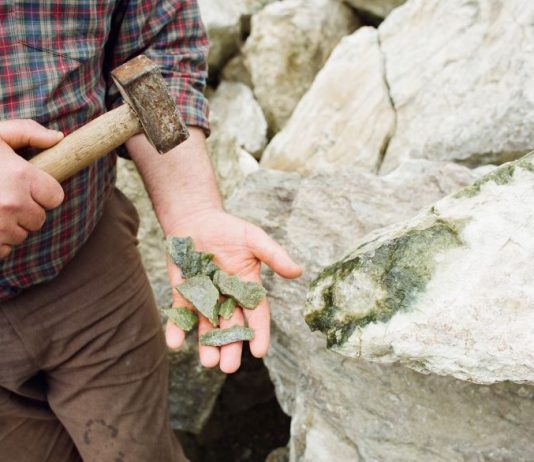 Connemara marble pieces being held in a hand