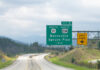 Smoky Mountains in North Carolina closeup on i26 highway road of exit sign for Burnsville Spruce Pine