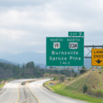 The Spruce Pine, NC Mining District Smoky Mountains in North Carolina closeup on i26 highway road of exit sign for Burnsville Spruce Pine