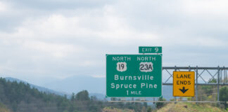 Smoky Mountains in North Carolina closeup on i26 highway road of exit sign for Burnsville Spruce Pine