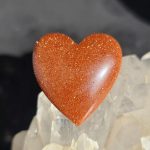 Goldstone: Cutting & Cabbing Tips orange goldstone cabbed into a heart shape