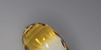 bi color citrine faceted in the acorn design