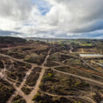 old mining area including paths and old spoil from the mines united downs near Redruth cornwall uk