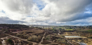 old mining area including paths and old spoil from the mines united downs near Redruth cornwall uk