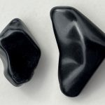 Jet Stone: Mysteries & Histories a piece of jet stone and a piece of obsidian for comparison