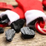 coal and a candy can in Christmas stockings