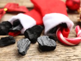coal and a candy can in Christmas stockings