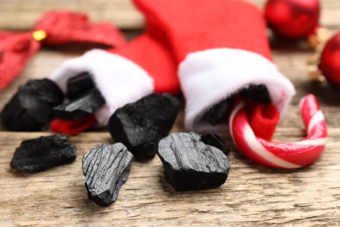 coal and a candy can in Christmas stockings