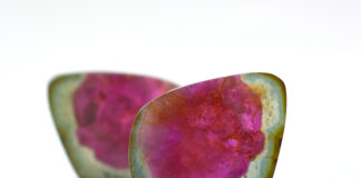 Watermelon Tourmaline Field Guide watermelon tourmalines pink and green polished and shiny on white background