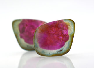 Watermelon Tourmaline Field Guide watermelon tourmalines pink and green polished and shiny on white background