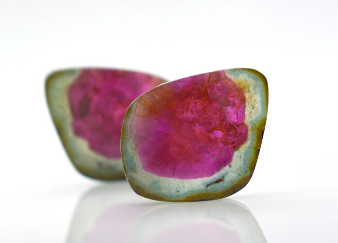 watermelon tourmalines pink and green polished and shiny on white background