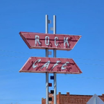 road sign for the rock cafe oklahoma