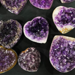 Amethyst heart-shaped stones carved as polished gemstone hearts