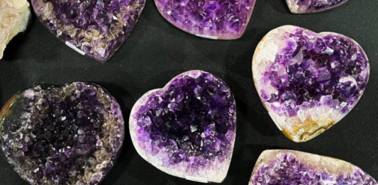 Amethyst heart-shaped stones carved as polished gemstone hearts