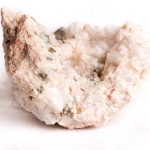 pink danburite rough on white background