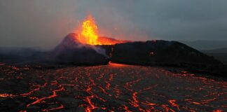 Icelandic volcano in eruption 2023. Detail of active crater with melting lava around.