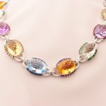 Necklace with birthstones by month featuring sapphire, ruby, amethyst, garnet, and diamonds set in white gold