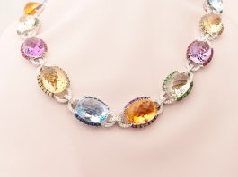 Necklace with birthstones by month featuring sapphire, ruby, amethyst, garnet, and diamonds set in white gold