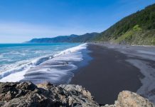 Black magnetite sand at Ocean Beach, California, makes it one of many fun mineral beaches to visit