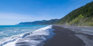 Black magnetite sand at Ocean Beach, California, makes it one of many fun mineral beaches to visit