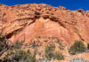 Desert Varnish: The Dark Streaks on Desert Rocks A view of an alcove and desert varnish in Utah.