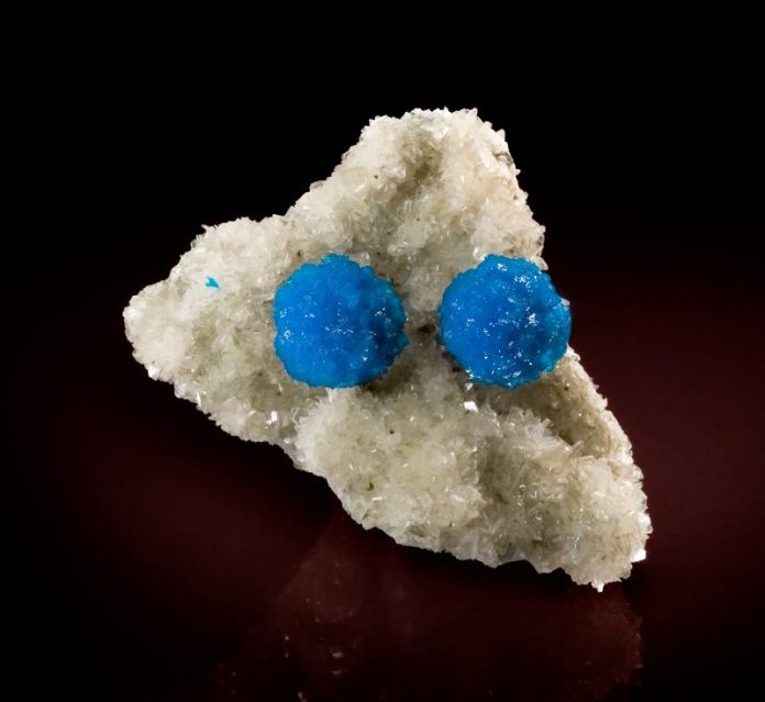 12 Minerals to Collect in 2025 cavansite on stilbite
