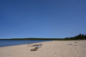 pink sand at sand point beach