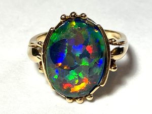 Knowing how is opal formed is important as synthetic specimens like this Gilson opal with large color flakes are available.