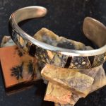 yellow, black, and blue-grey australian dendritic opal bracelet made setting opals without prongs