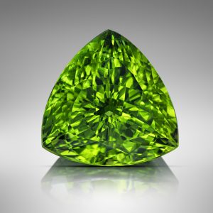 peridot gemstone with a trillion cut