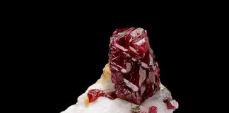 spinel gemstone perched on matrix