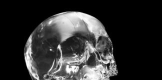 Crystal skull on black at angle ancient South American artifact