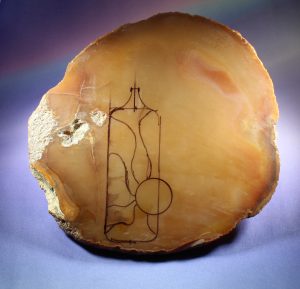 drawing an agate jewelry design on a slab